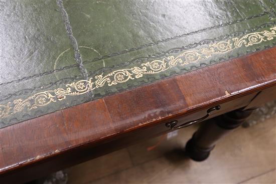 A Victorian mahogany partners writing table, with green gilt tooled leather inset top W.150cm